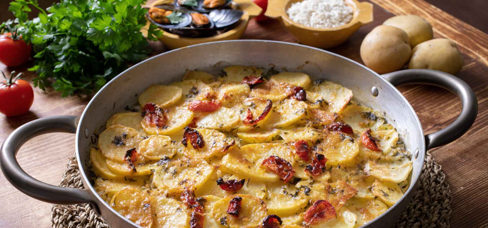 Riso, patate e cozze: la ricetta della tiella barese